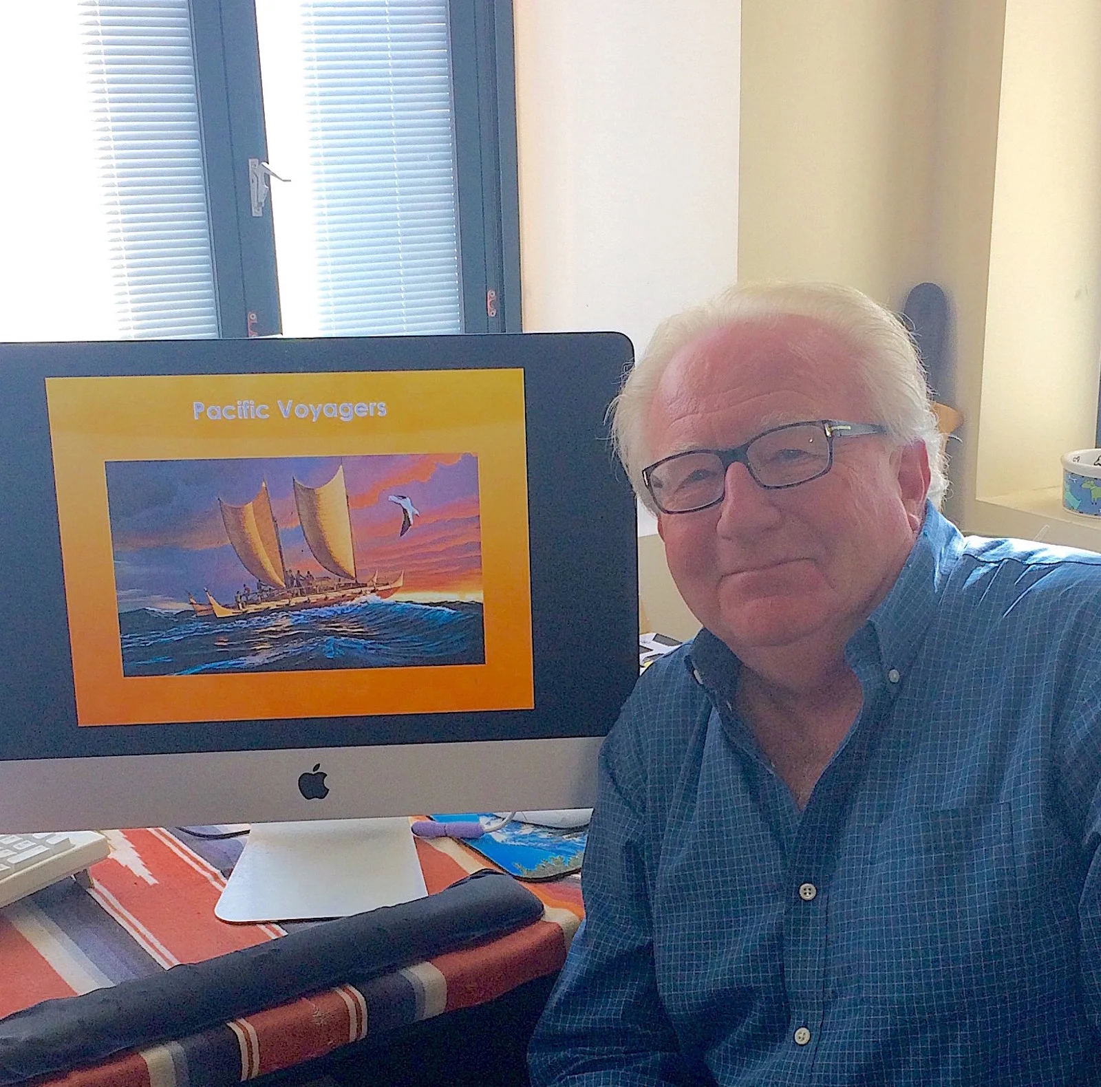  History professor Paul Spickard sits beside a slide from his presentation at the October 12 opening of “Botanical Illustrations and Scientific Discovery,” a new exhibit at UCSB’s library. 