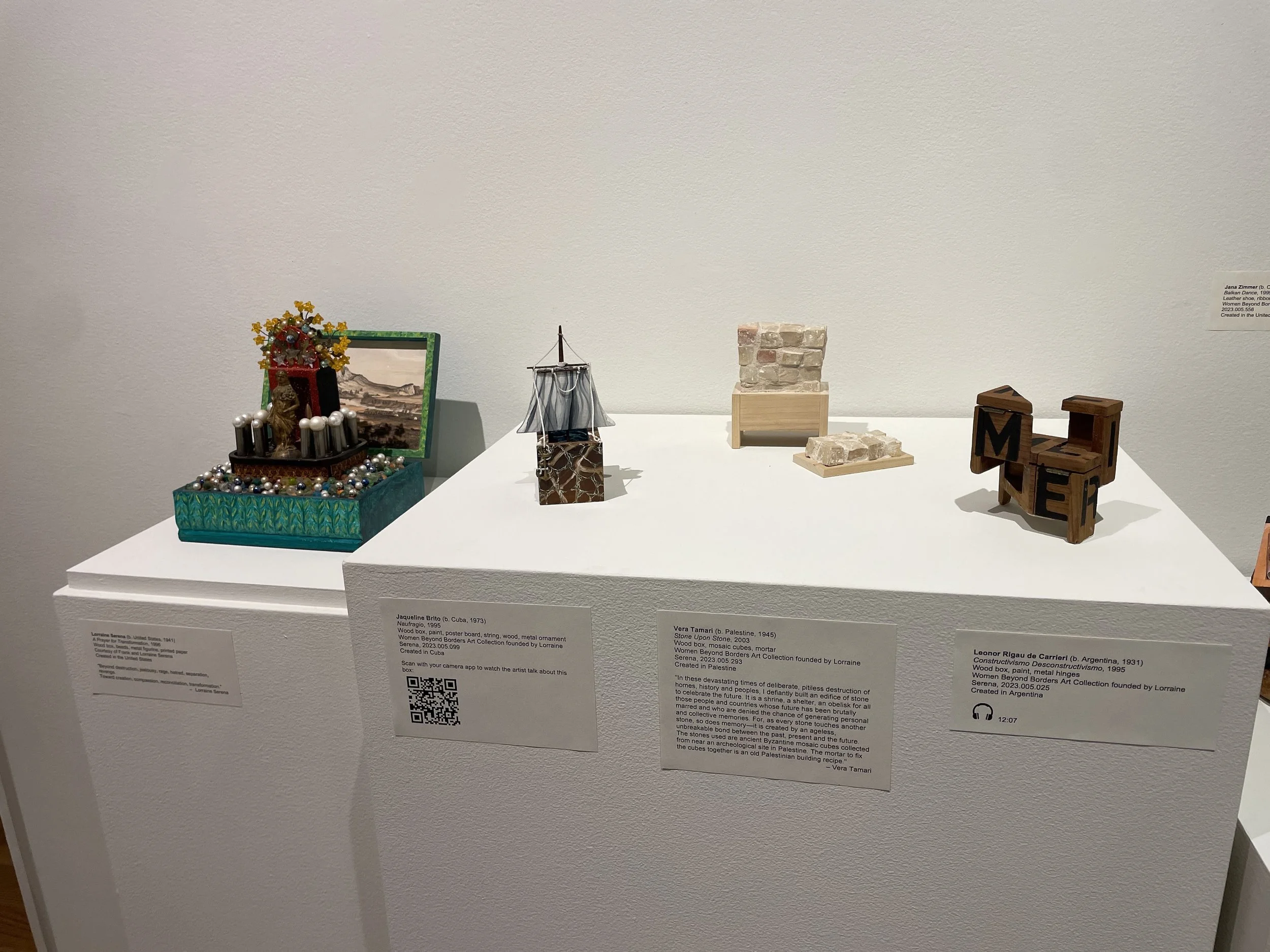  An array of boxes in the AD & A Museum’s “A Box of One’s Own: Women Beyond Borders” exhibit featuring the work of artists Lorraine Serena, Jaqueline Brito, Vera Tamari, and Leonor Rigau de Carrieri (left to right). 