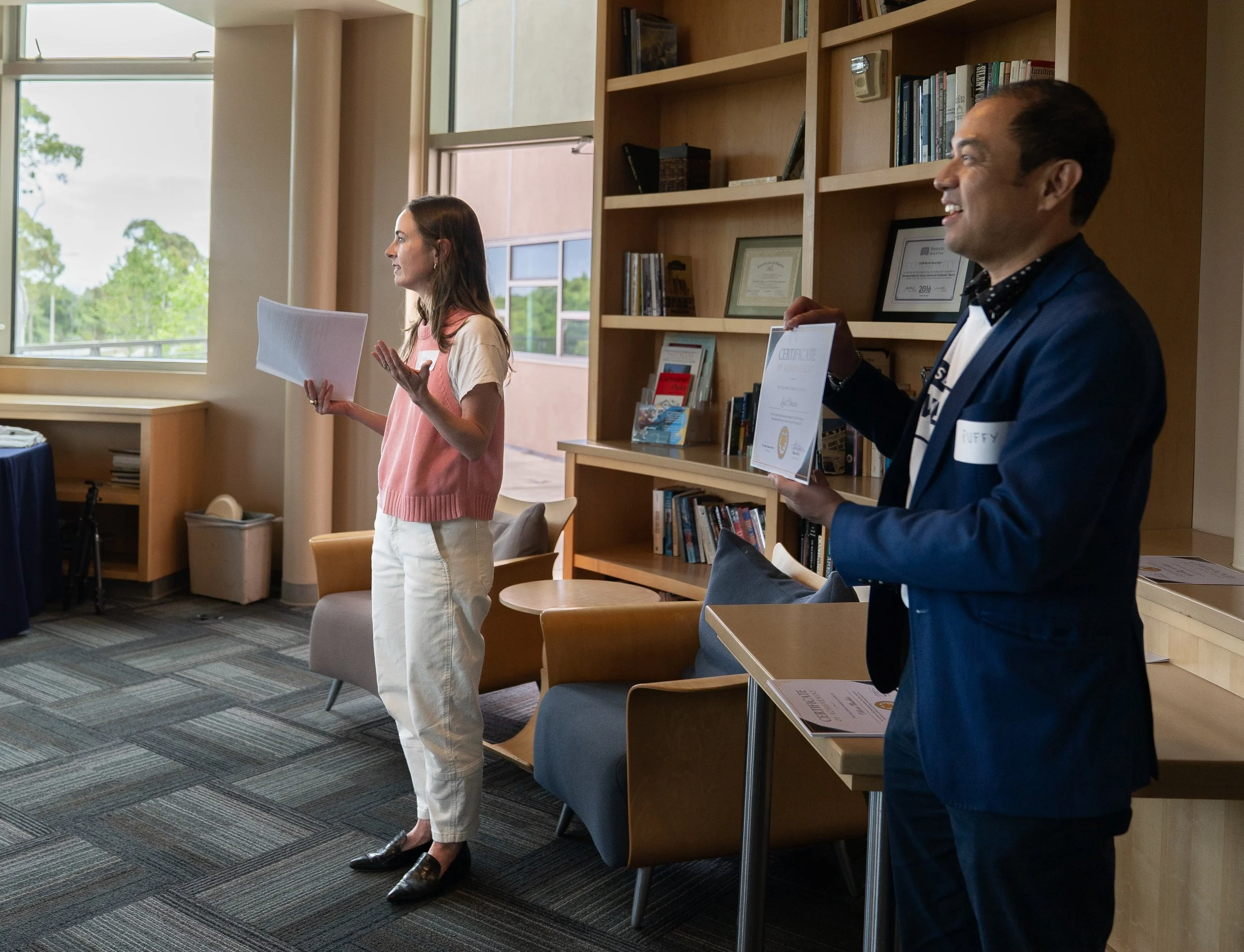   Ellen O’Connell Whittet, left, of UCSB’s Writing Program and Theater alum Ruffy Landayan address the student winners of the Give Day Creativity Contest, on behalf of the Division of Humanities and Fine Arts.  