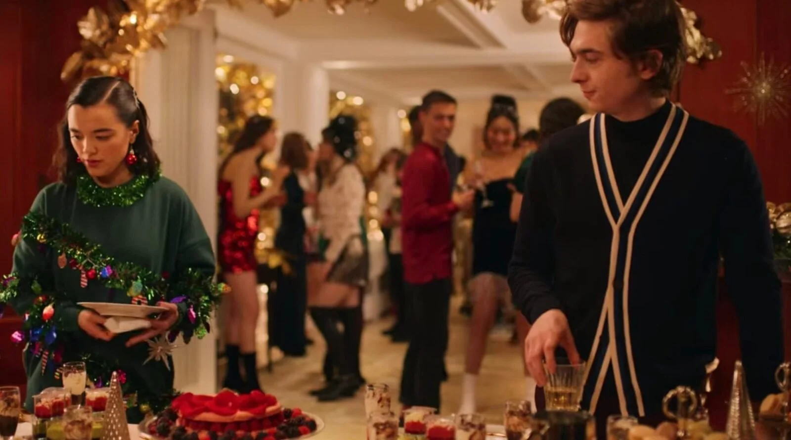  Lily (Midori Francis) and Dash (Austin Abrams) at a Christmas Eve party in New York in the Netflix series ”Dash & Lily,” produced by UCSB alumnus Brad Silberling. 