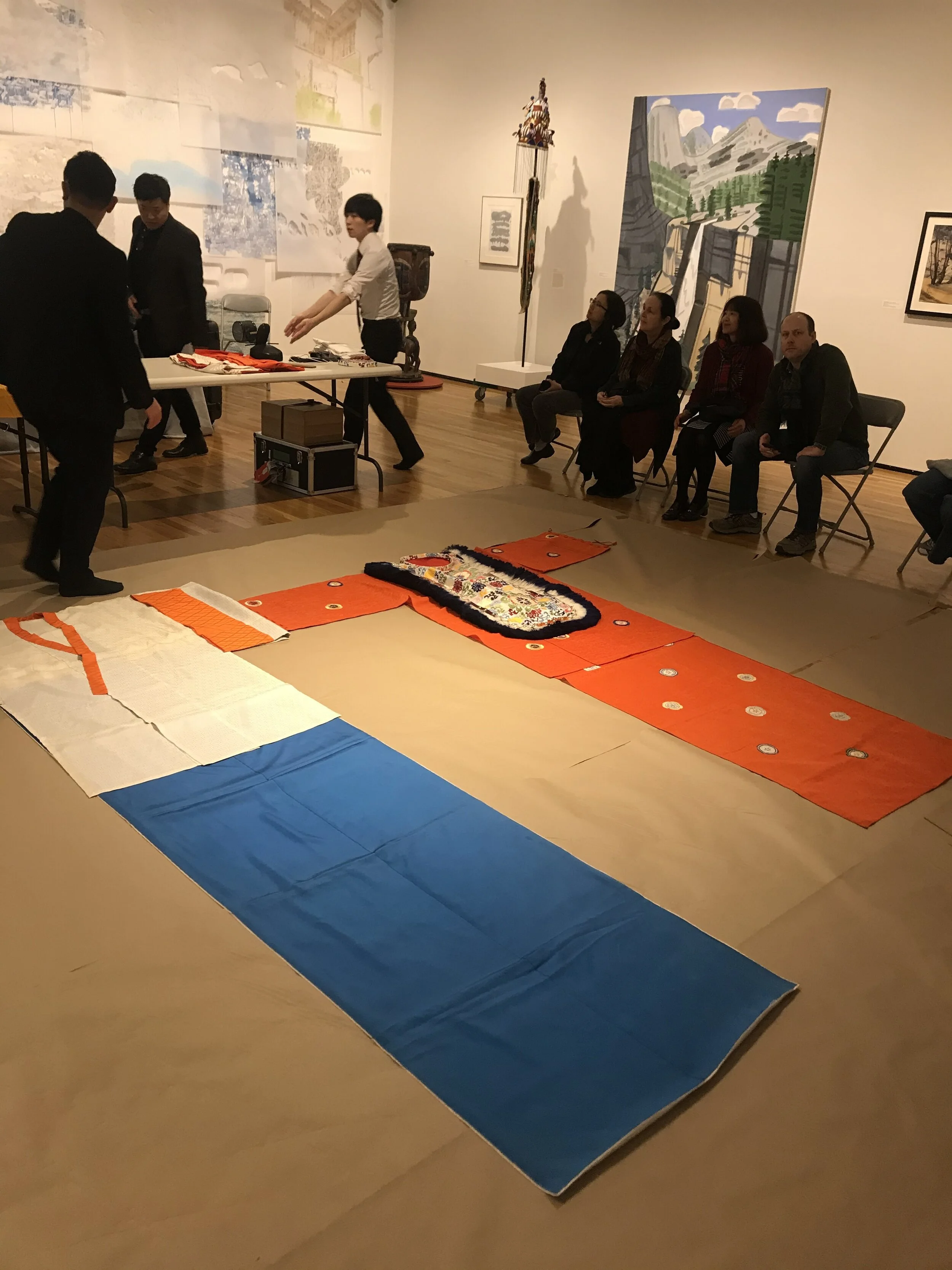  Gagaku ensemble performers displaying their costumes in the AD&A Museum at the Kimono Display event. Photo by Anabel Costa. 