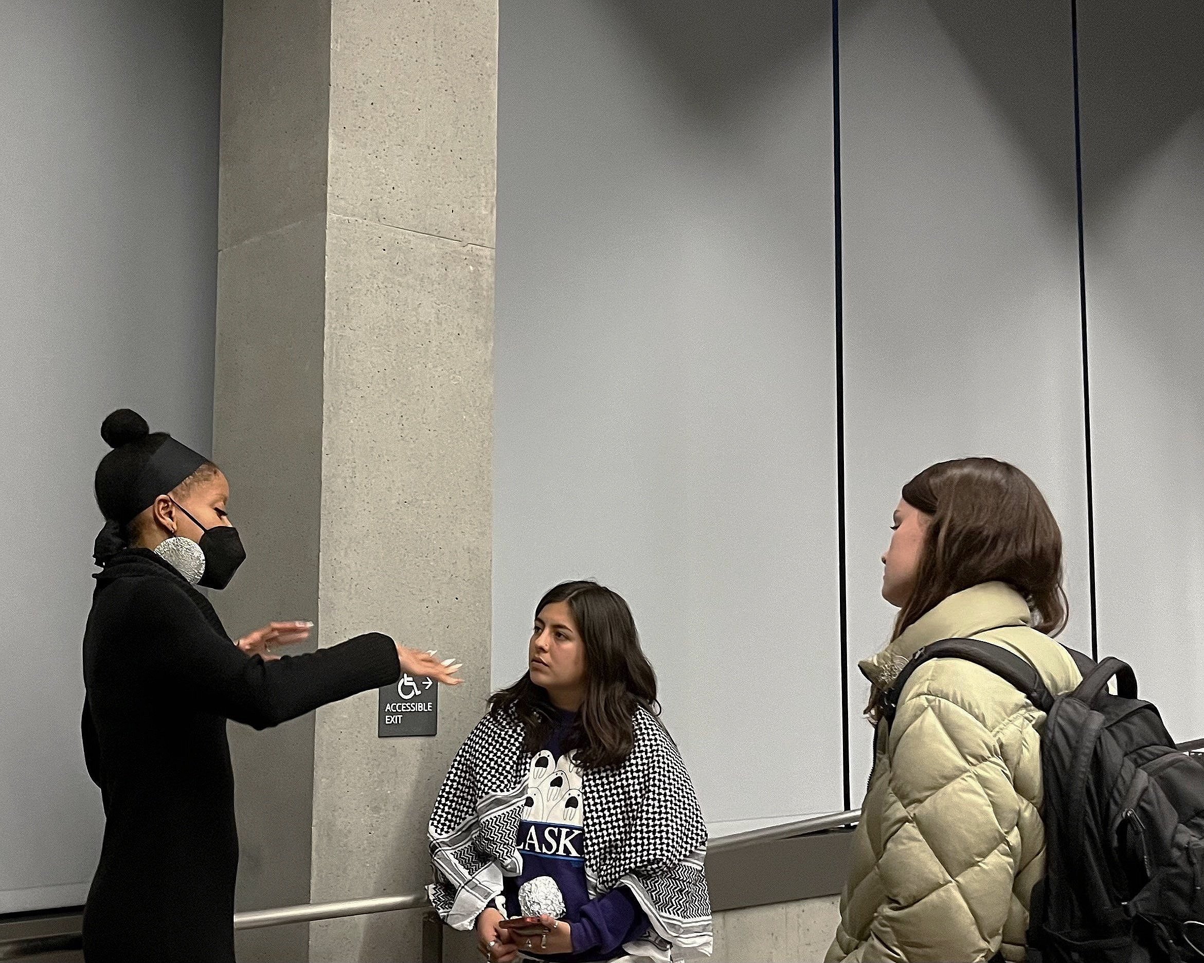  Legal Scholar Khiara M. Bridges speaks to UCSB students Lena Mitchell (center) and Zoe Crews (right) after the talk, “Race in the Roberts Court: Dobbs v. Jackson Women’s Health Organization,” hosted by the Walter H. Capps Center. 