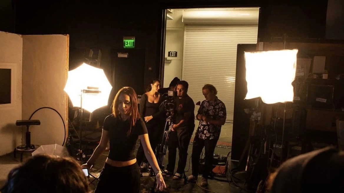  The film’s director Iris Ortega, left, Schultz, right, and other members of the crew during production.  Photo by Raziel Espagña.  