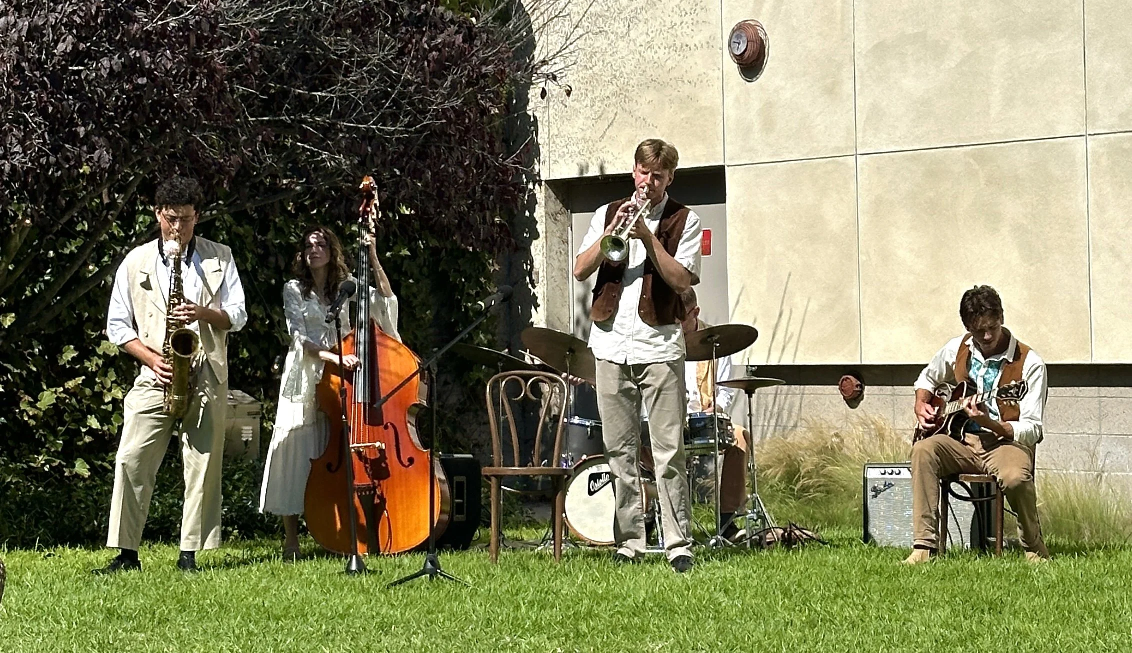  A live band accompanied the actors in  Much Ado About Nothing , playing through transitions between scenes and during party scenes.  