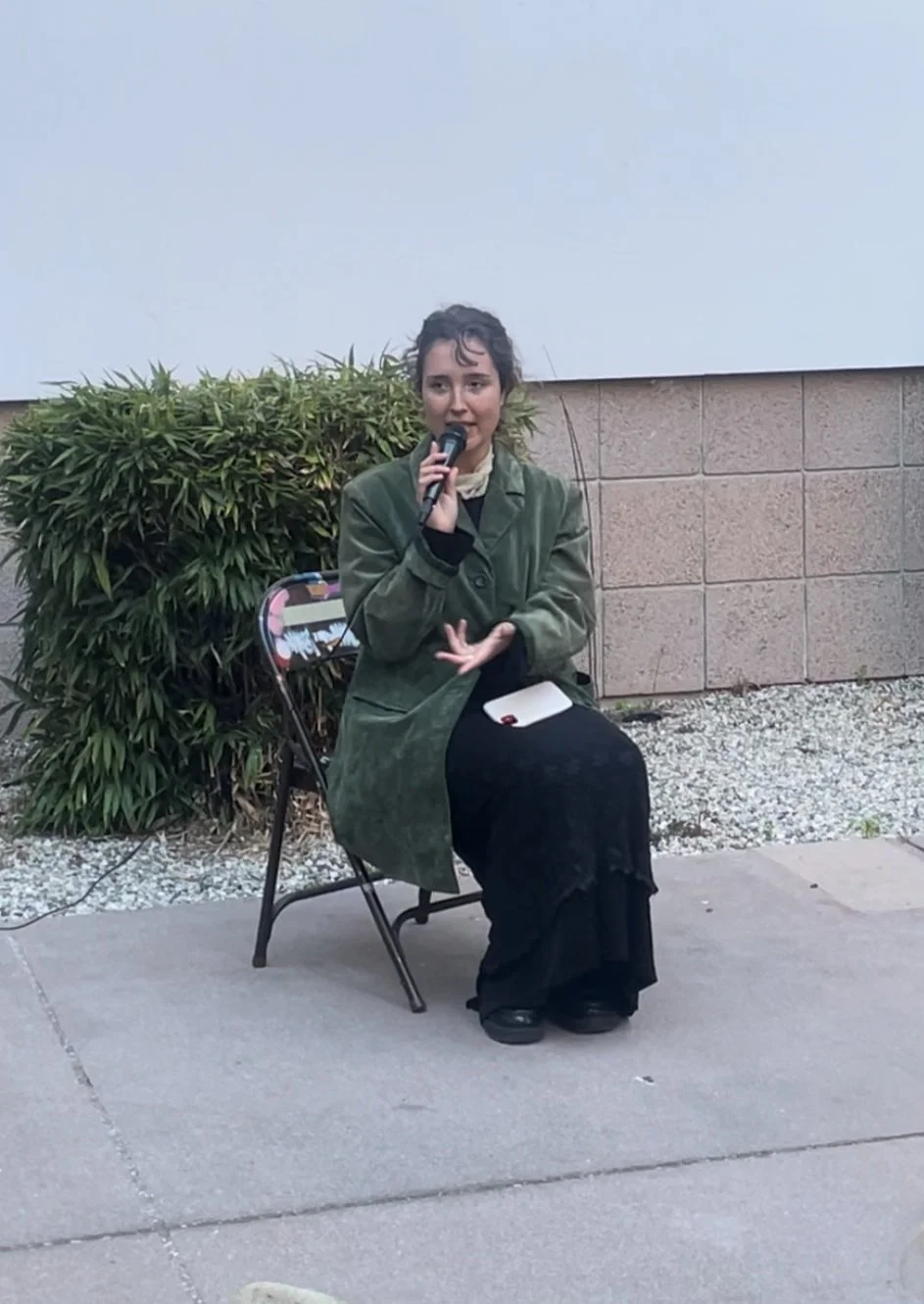  UCSB student Emilie Risha performs a piece of spoken-word poetry at the reception for the Glassbox Gallery’s  Originalia exhibition. 