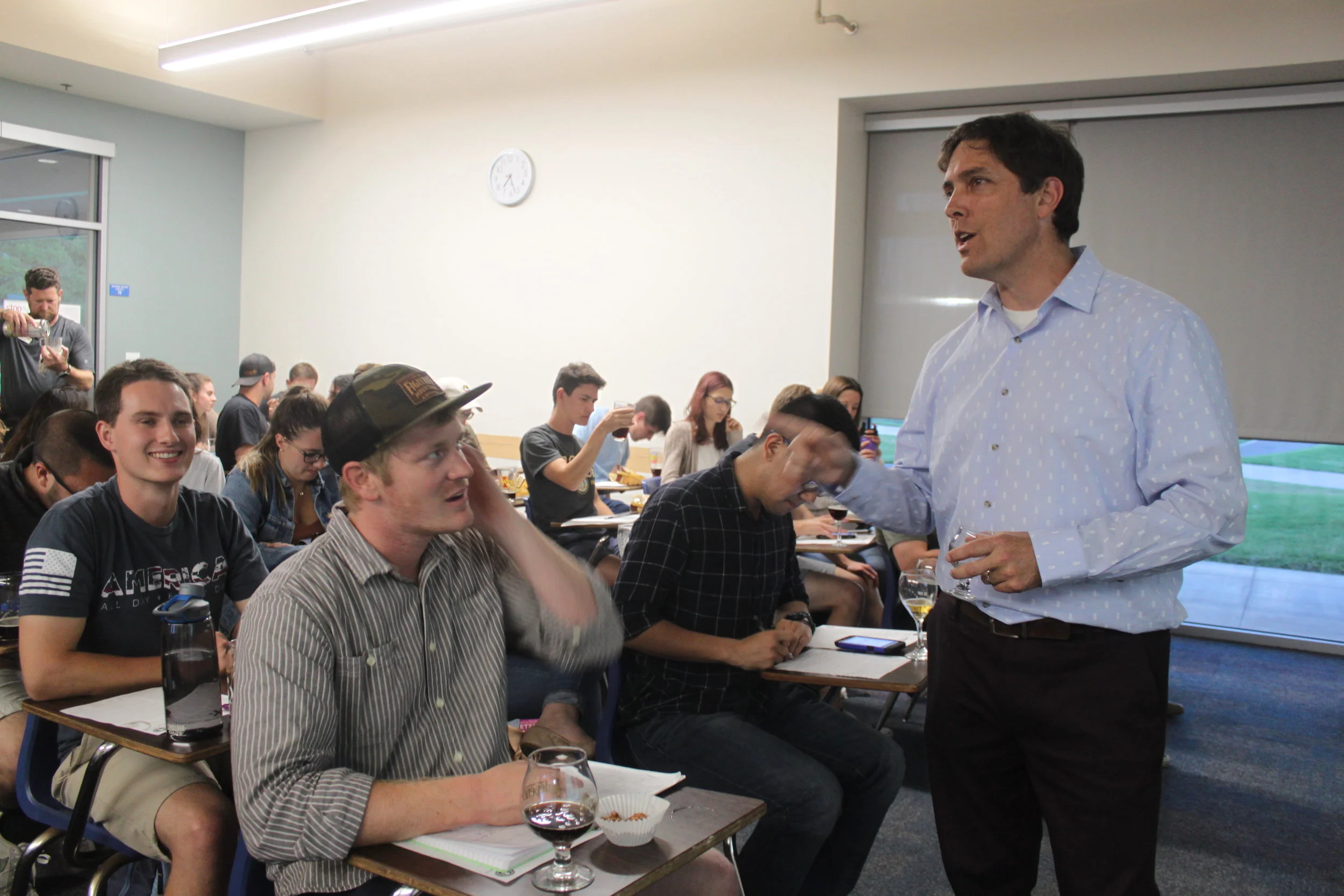  Religious Studies alumnus Brian Yaeger answers questions from students in between beer tastings during his Beer 101 class, offered by UCSB’s Recreation Department. 