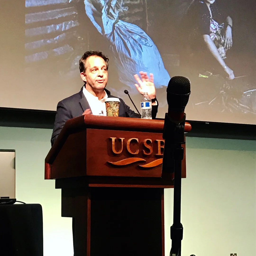  The speaker emphasizing points on European and American immigration policies. 