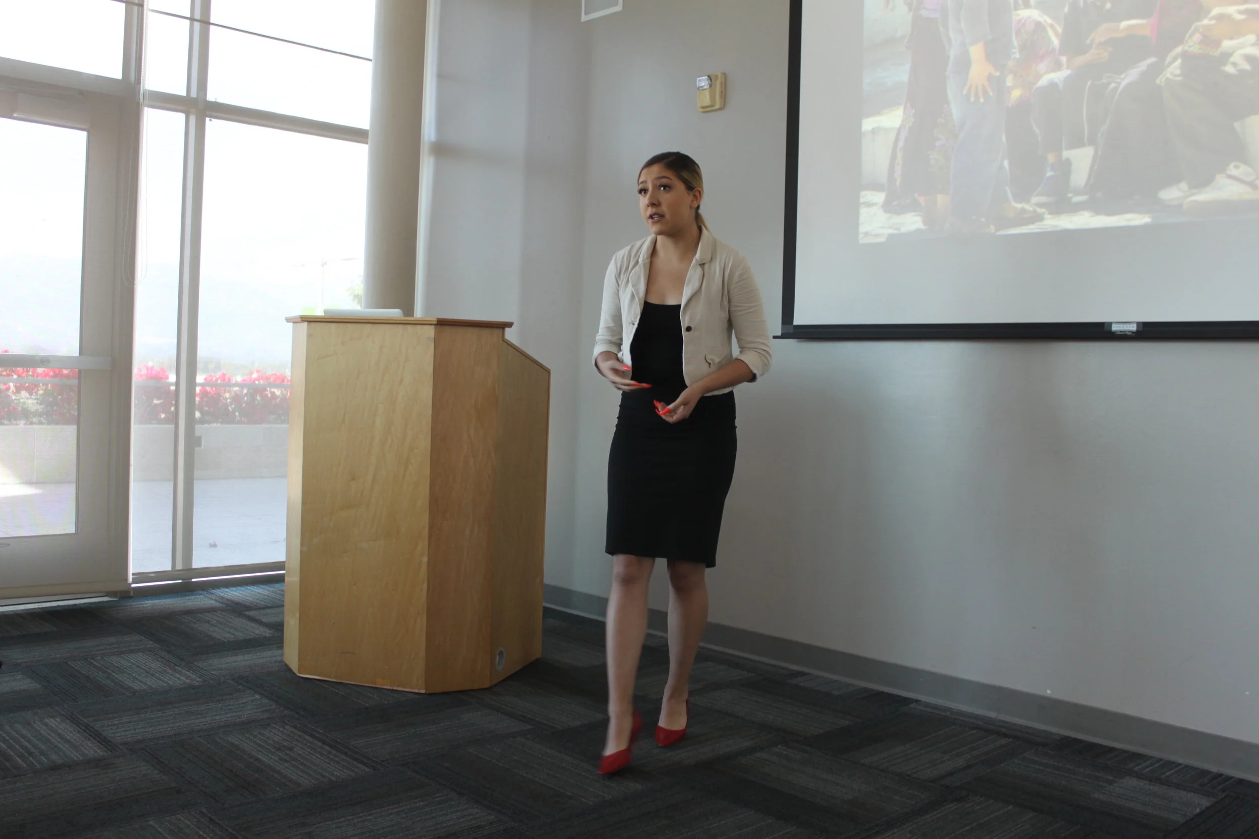  Student Diana Mendoza presents her research project  Hiding in Shadows: The Experience of Undocumented Working Service Employees of Hispanic Origin  at the 2018-2019 Raab Writing Fellows Showcase. 