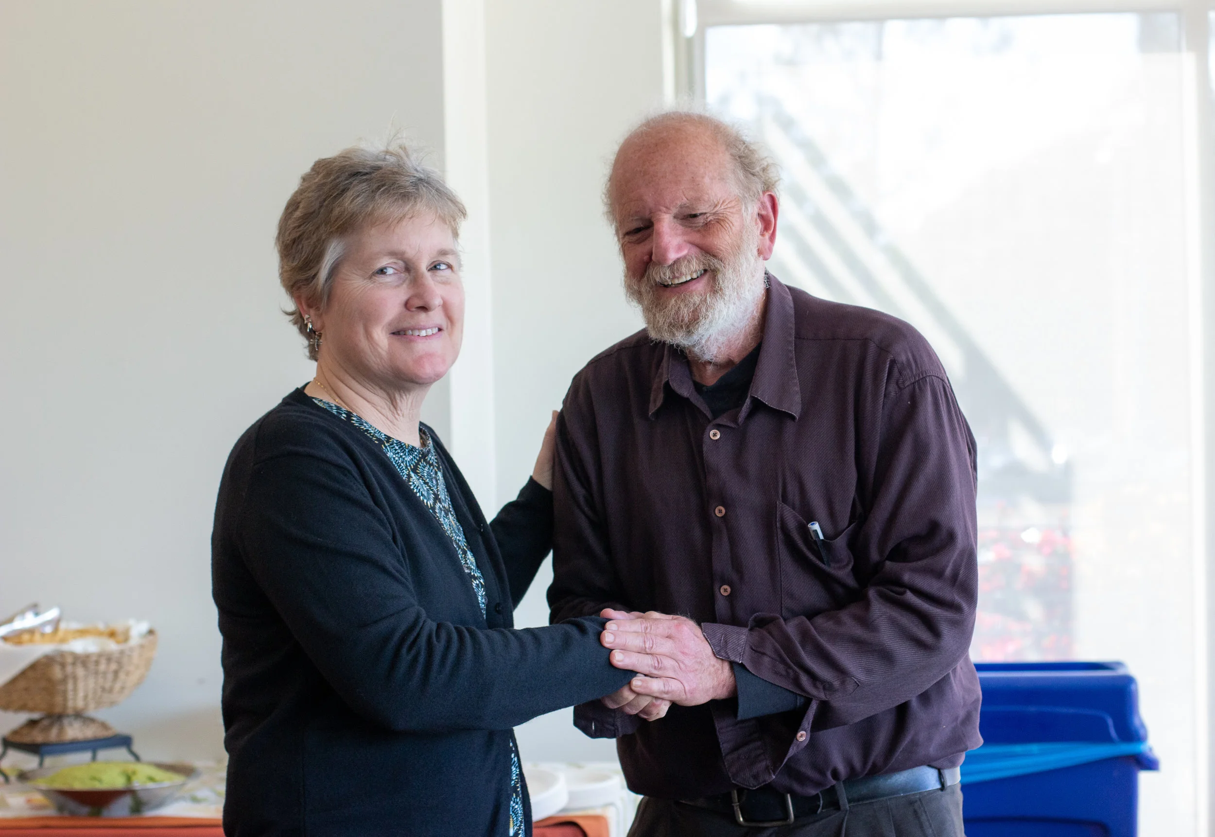  UCSB professor of education Charles Bazerman congratulating writing professor Kathy Patterson on receiving the 2019 Endowed Faculty Fellowship for Professional Development in Writing.  Photo by Karina Lucero Aleman.  