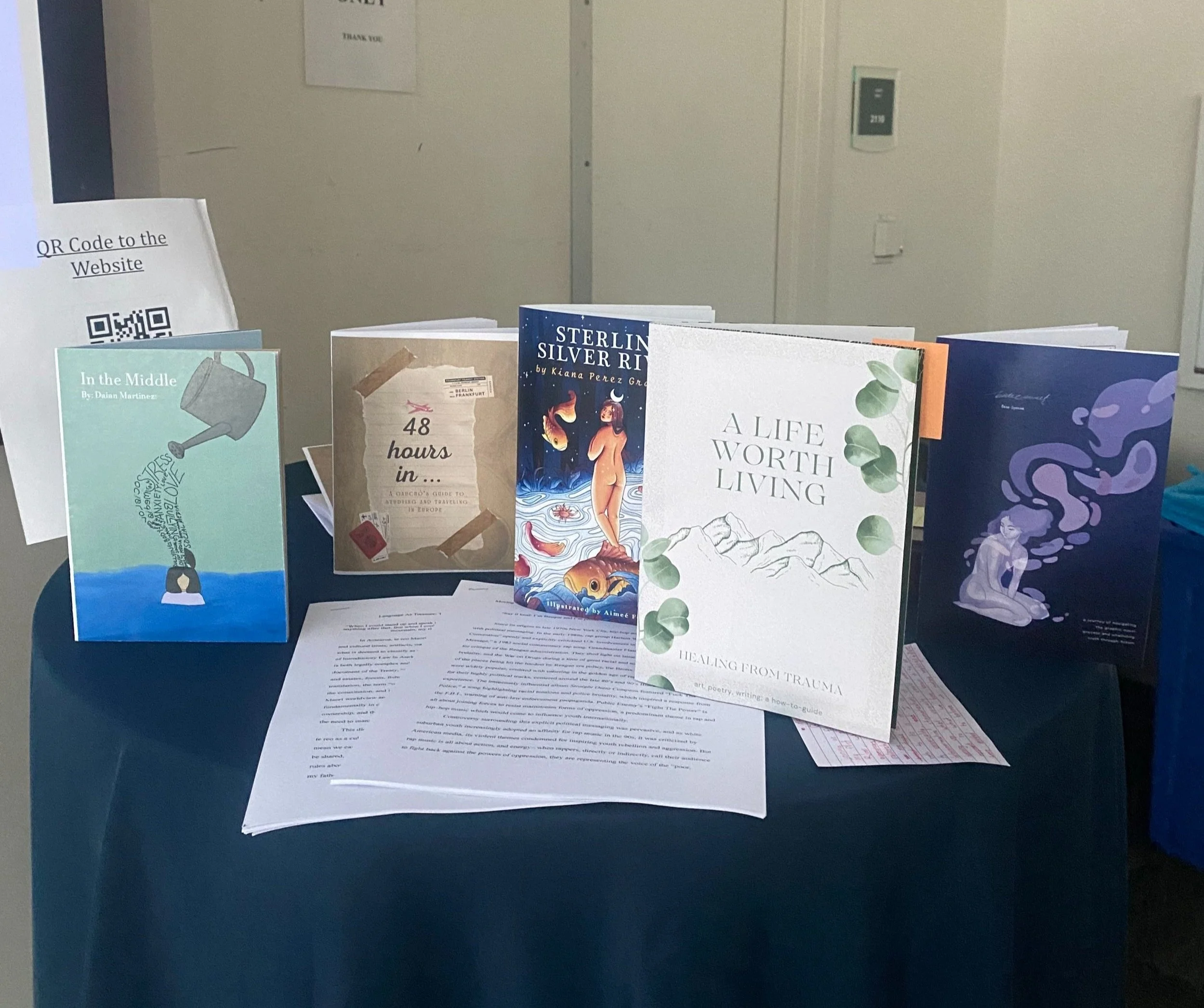  Several works created by the 2023 Raab Writing Fellows.   