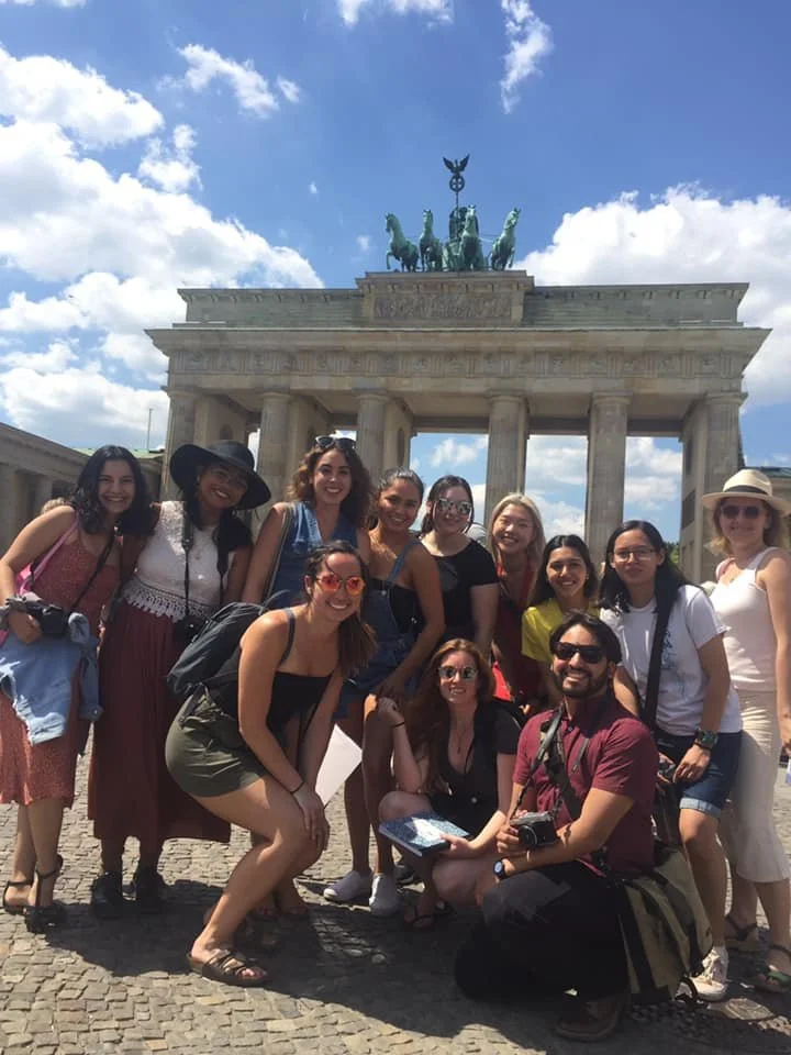   Noe Padilla ‘20, front right, an alum of UCSB Writing’s journalism program, in front of the Brandenburg Gate on a 2019 summer course in Berlin, which he says impacted how he works now as a journalist.  