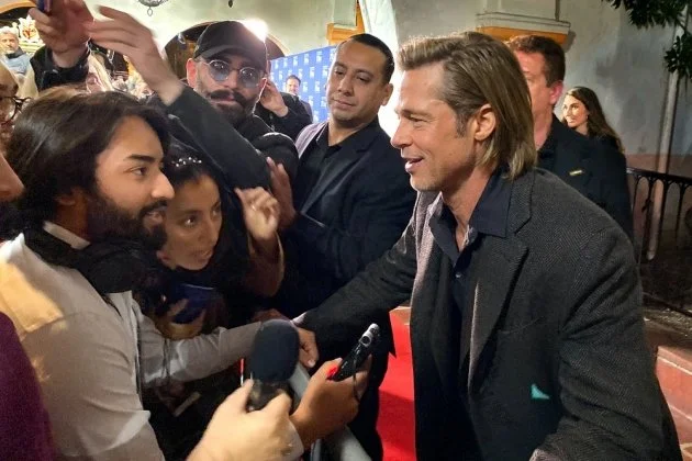   UCSB Writing Program alum Noe Padilla, left, when he, as a student reporter, interviewed actor Brad Pitt in January, 2020 at the Santa Barbara International Film Festival.  