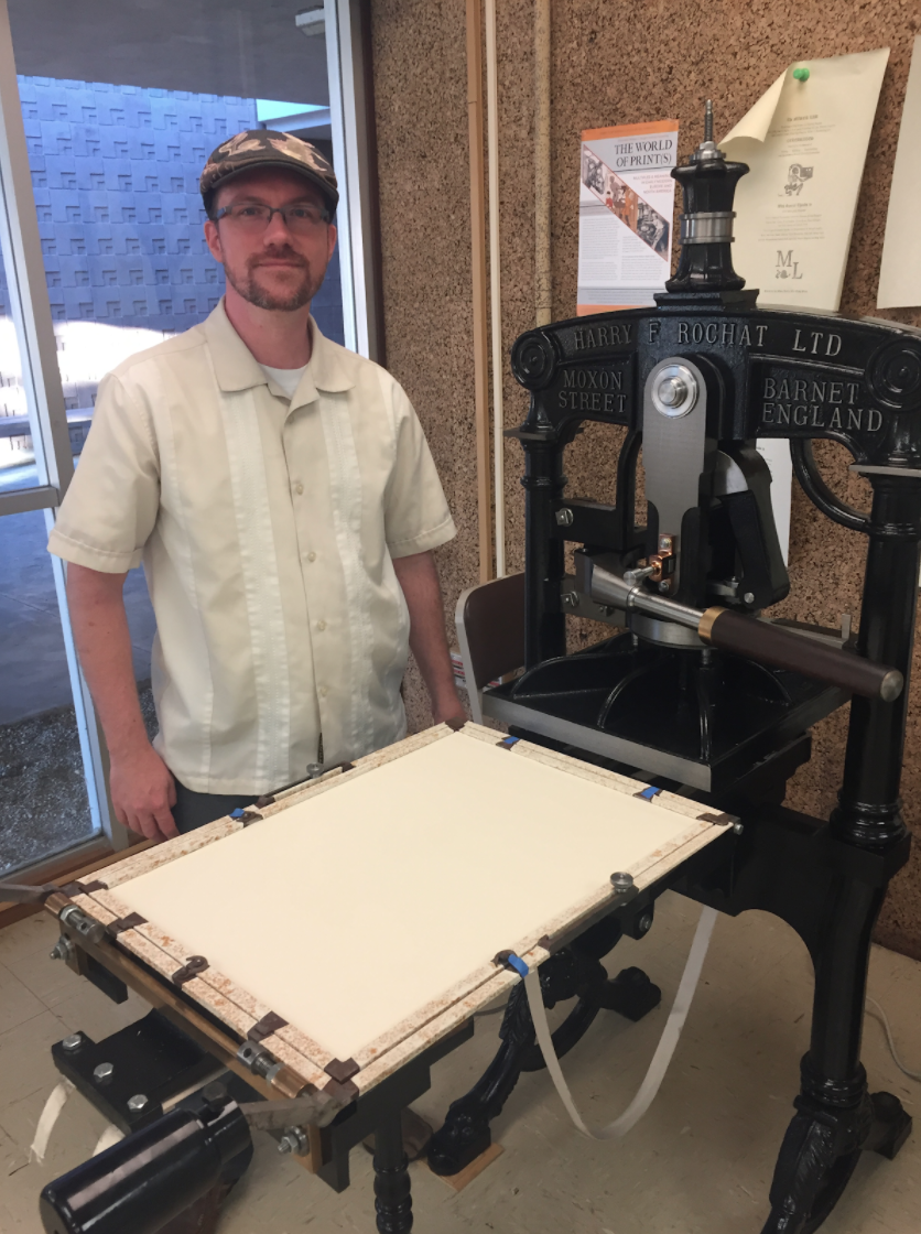 Faculty Director of the DAHC Jeremy Douglass with ‘Mad Madge’ herself - a 19th century Albion printing press. 