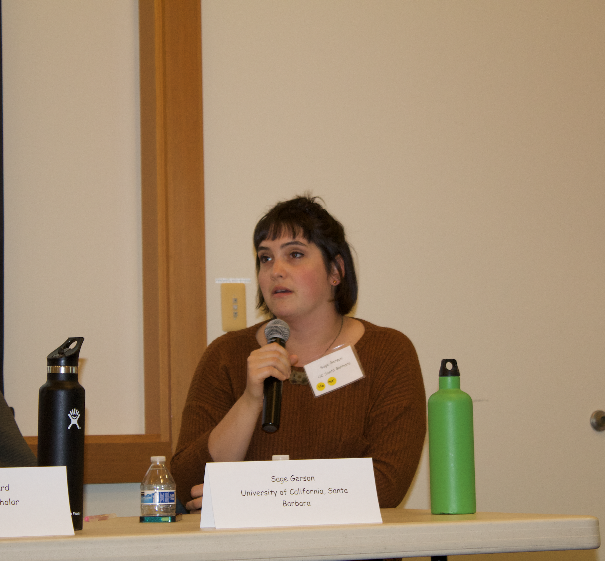  Speaker Sage Gerson addressing the audience during a Q&A following her presentation with fellow speaker Brendan Leonard, “Out of Narrative Sight, Out of Mind: A Cultural Commentary on Indifference to Incarcerated Labor in the Graphic Narrative A Fire Story.” 