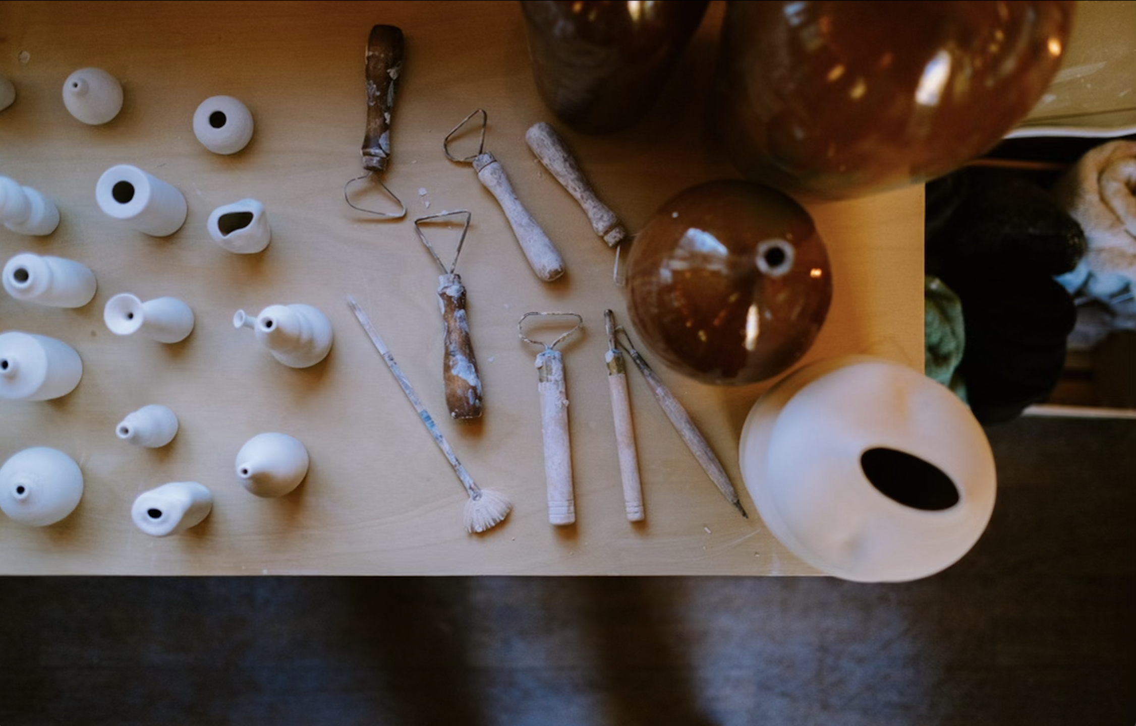  Viral potter and UC Santa Barbara student Theo Hirschfield makes clay sculptures in his camper-turned-studio.  