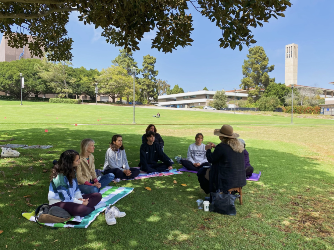  Rumi Education Center interns Kiana Ranjbaran, far right in gray sweatshirt, and Parisa Ansari, far left, take part in a recent Tuesday meditation session. 