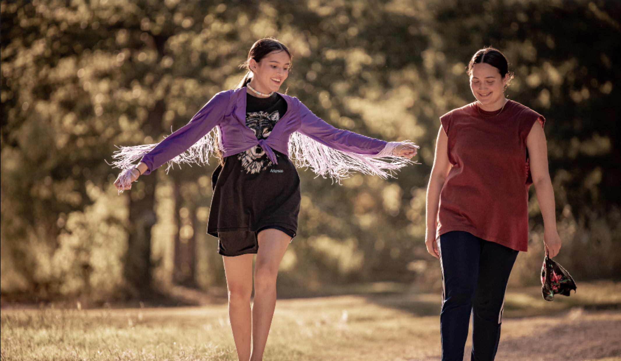  In the film “Fancy Dance” Roki walks next to her aunt Jax, wearing her mother’s jacket, which director Erica Tremblay described as a physical representation of the mother—like a hug wrapped around her.  