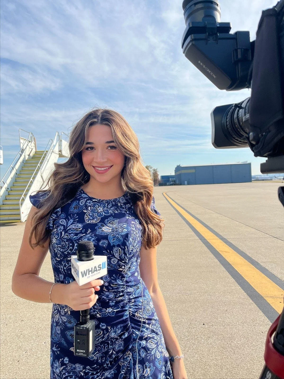   UCSB Writing alum Alexandra Goldberg covering  Minnesota Gov. Tim Walz’s arrival to Louisville, Kentucky International Airport on Oct. 23, 2024 for WHAS11, an ABC local news affiliate in Louisville.  