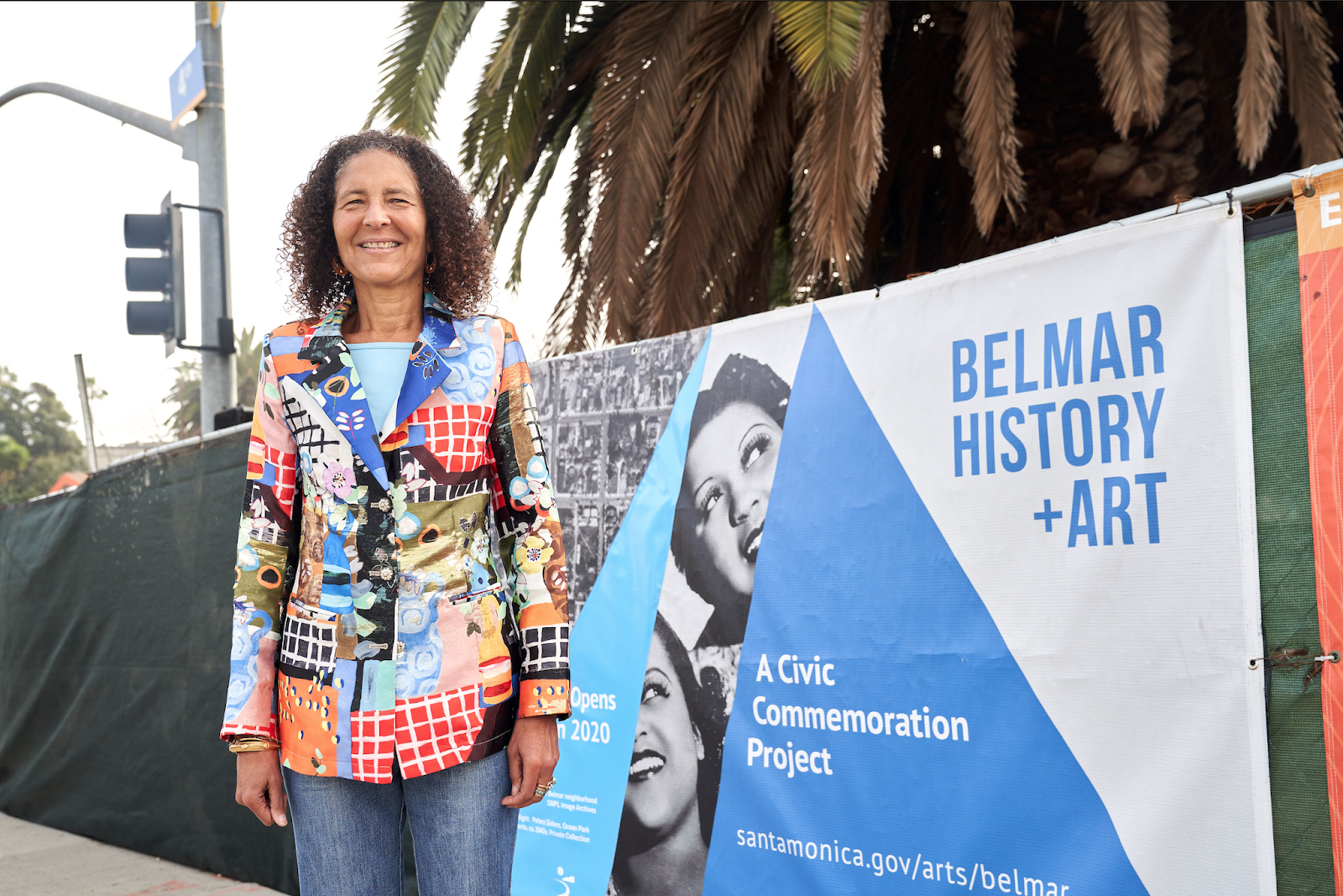  UC Santa Barbara alumna, Alison Rose Jefferson, in front of a banner for the Belmar History + Art project in Santa Barbara. Photo by Leroy Hamilton. 