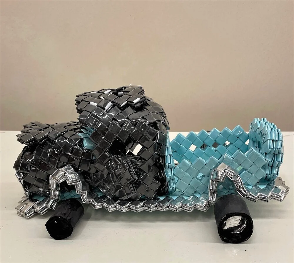  Artist Francisco Mendoza’s sculpture entitled “ Lowrider Truck ” appears in UCSB’s new library exhibition, “Beyond The Wall: The Prison Art Resistance.” The art piece is made from found materials such as trash and folded-up paper. Photos courtesy of the UCSB Library 