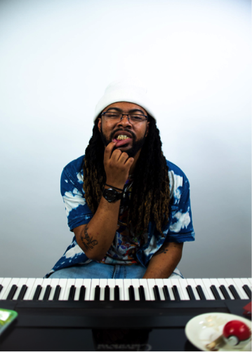  Above is a glimpse of Jordan Mitchell in his natural habitat, making music. 