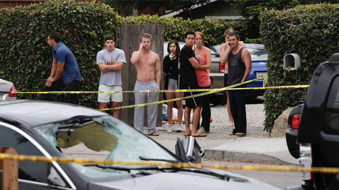  Students taking in the aftermath of the 2014 rampage. Photo by Irfan Khan, courtesy of NBC 4. 