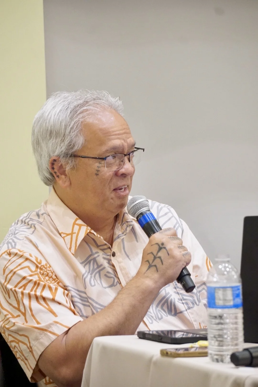   Edward Halealoha Ayau, chair of the Native American Graves Protection and Repatriation Act review committee, tells a UCSB audience that education is the key to bringing peace to Native Americans and their ancestors.  