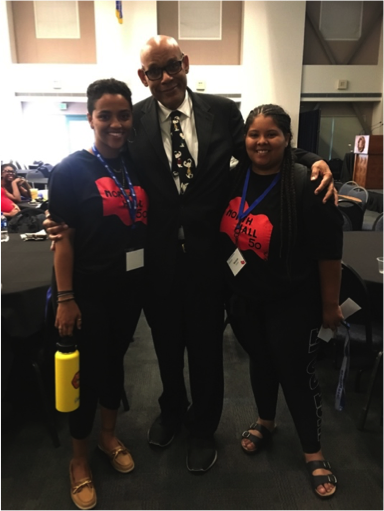  UCSB Black Studies professor Jeffrey Stewart stands with Black Student Union president Mariyah Lewis and third-year student Alexandra Gessesse before an intergenerational alumni and student dialogue panel commemorating the North Hall Takeover. 