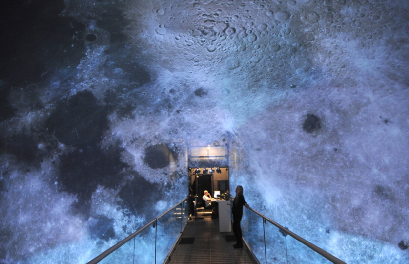  Lab director JoAnn Kuchera-Morin and media systems engineer Matthew Wright use an image of the moon to calibrate the AlloSphere research instrument.  Photo by Paul Wellman 