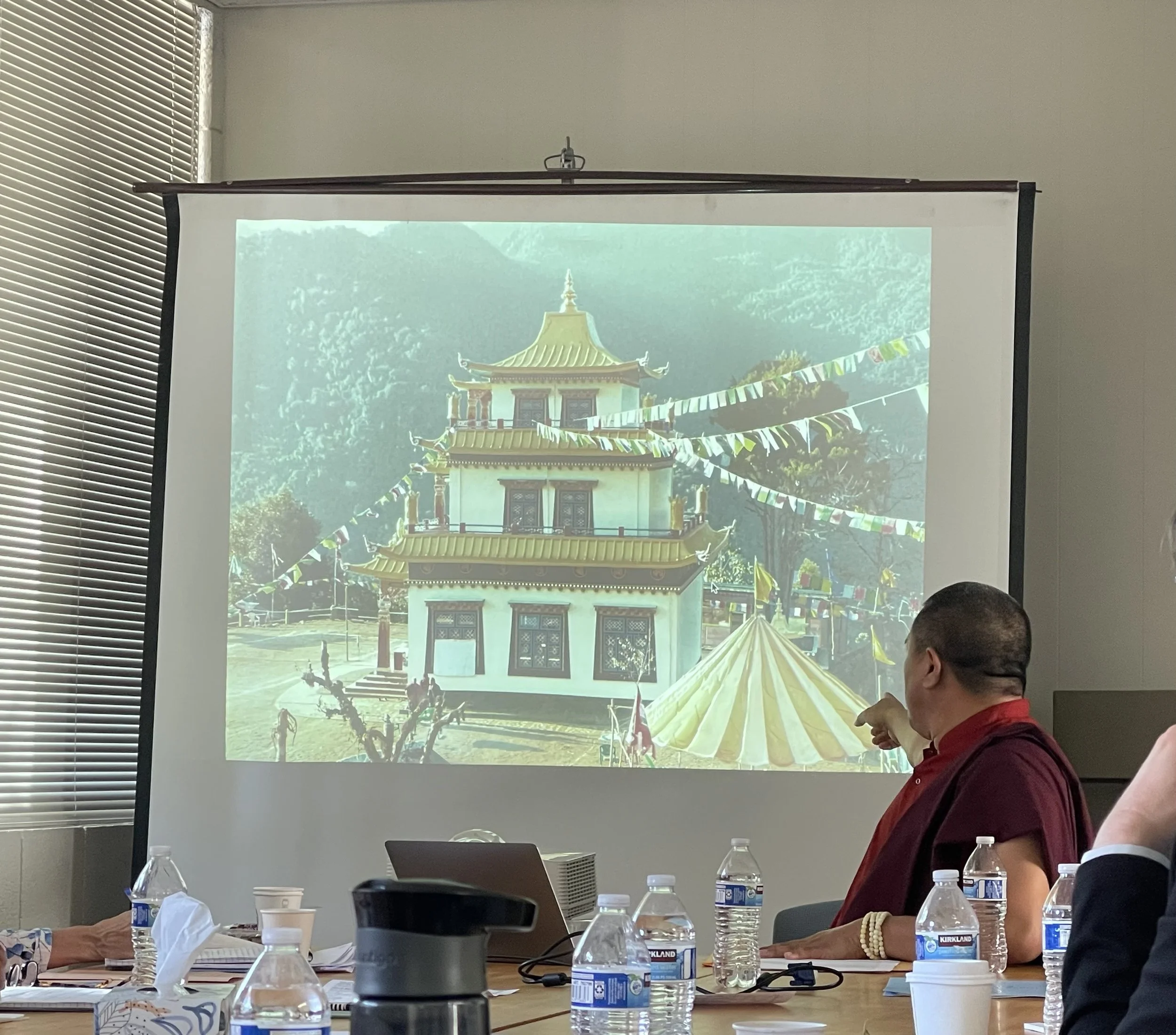  UCSB Religious Studies workship speaker, Tulku Orgyen, a revered Buddhist, shows the final product of a temple his lineage built in Tibet. 
